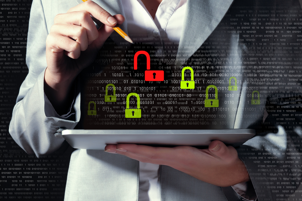 Businesswoman holding tablet pc entering password. Security concept-1